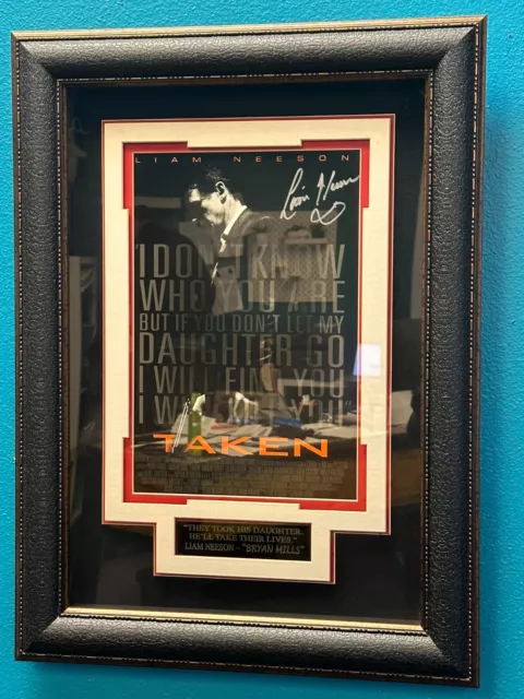 Framed autographed Taken movie poster