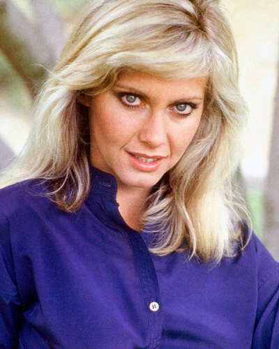 OLIVIA NEWTON-JOHN 8x10 inch photo 1970's pose in purple blouse