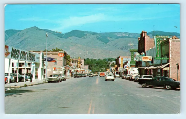 SALMON, ID Idaho ~ Main Street Scene USED CAR DEALER  c1960s Cars Postcard