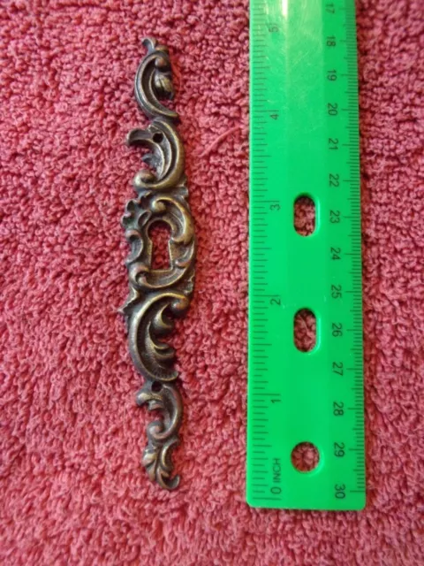 Antique key hole escutcheon Cast Brass Ornate door or trunk hardware salvage 5"