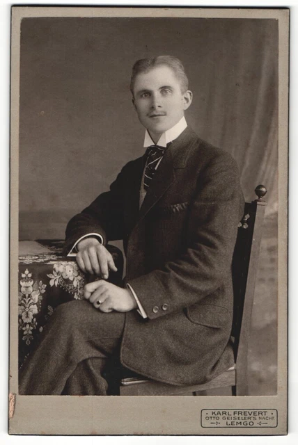 Photography Karl Frevert, Lemgo, young man with striped tie sits with