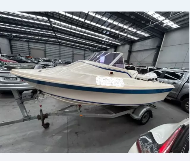 2007 Streaker Open Cab Boat and single axle trailer
