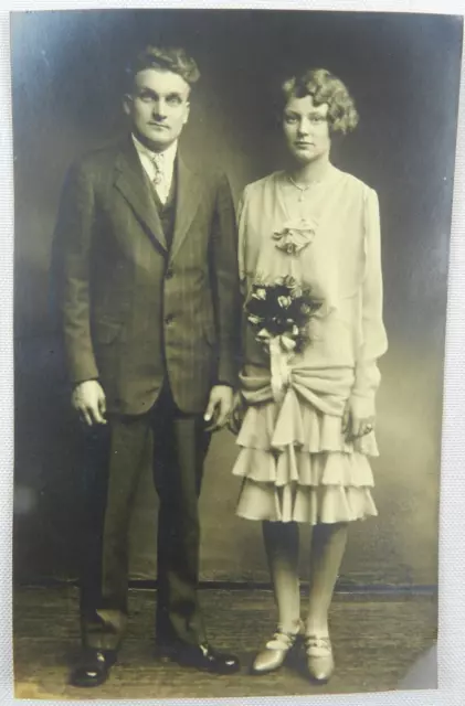 Young Man with Suit and Tie, Woman in Floral Style Dress Portrait - Photograph