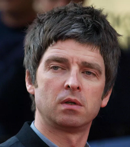 Oasis Unsigned photo - Noel Gallagher - Donation to Cancer Charity *7