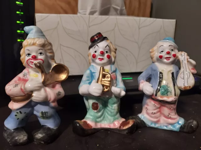 Set of 3 vintage ceramic clown figurines playing musical instruments