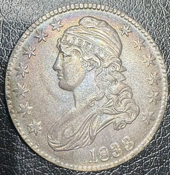 1833 Calped Bust Half. Nice Luster And Toning. AU+