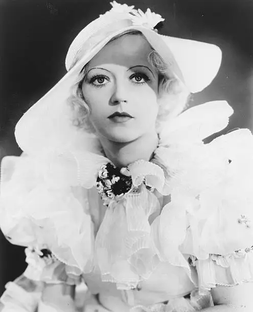 actress Marion Davies, wearing wearing a ruffled dress and hat, - 1930 Old Photo