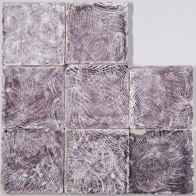 8 Dutch Delft manganese tiles, fantasy decoration, 17th century