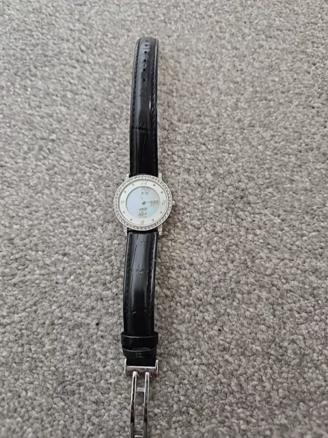 Butler & Wilson Ladies Spinning Face Watch With Black Leather Strap