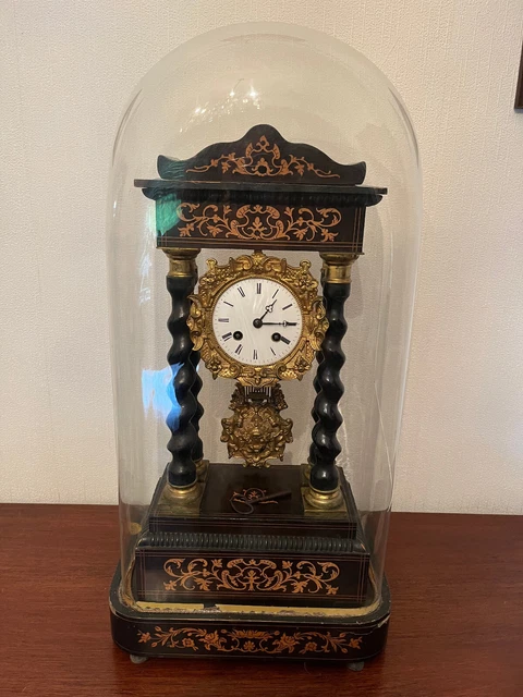 Orologio a pendolo Napoleone III in legno ebanizzato, intarsiato  Francia