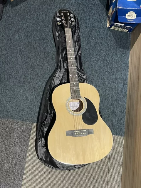 Martin Smith Guitar. Spare strings, clip on tuner, bag and stand included