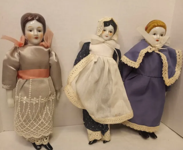 Vintage Bisque  Dolls Porcelain Face And Feet Colonial Prairie Cloths set of 3