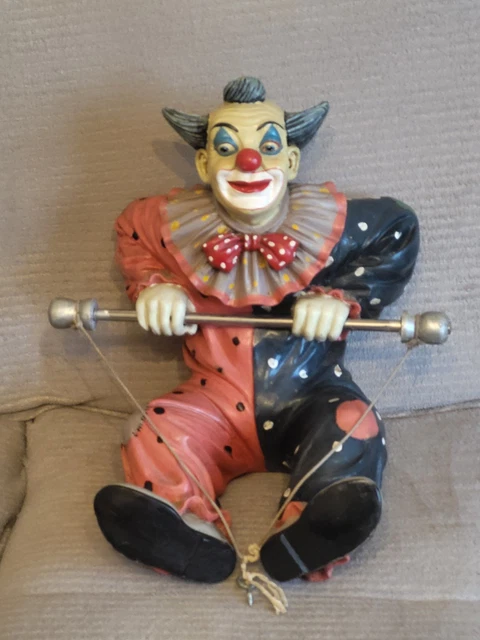 A Jun Asilo resin clown on unicycle figure