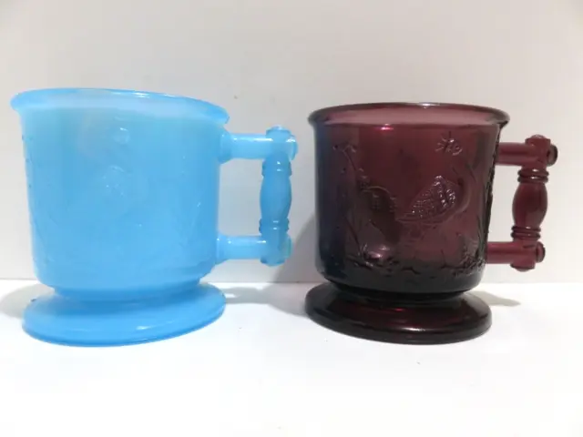 Vtg 2 Degenhart Glass Amethyst & Blue Milk Slag Stork & Peacock Child's Mug Cup