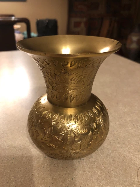 A wonderful smaller and wider brass vase with nice decorations engraved on vase.