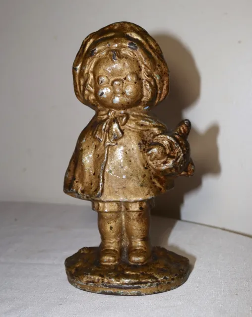 rare antique late 1800's solid cast iron girl with basket heavy figural doorstop