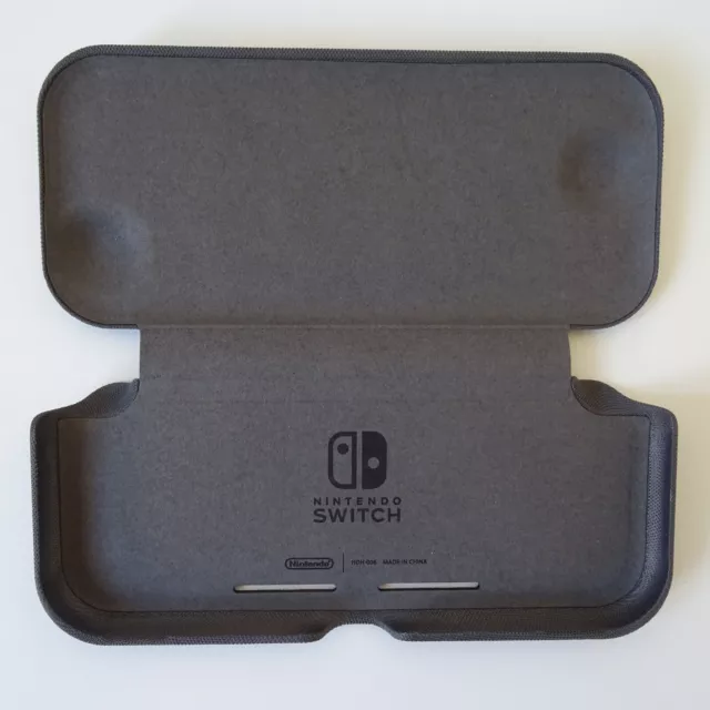 funda rígida plegable cierre imantado Nintendo Switch Lite oficial - como nueva