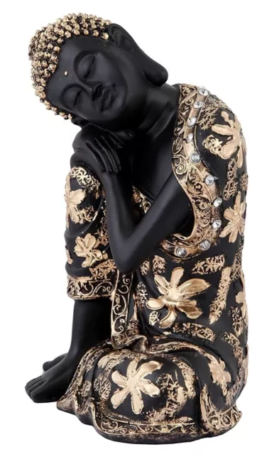 una hermosa estatua de Buda en reposo de resina de color negro y...