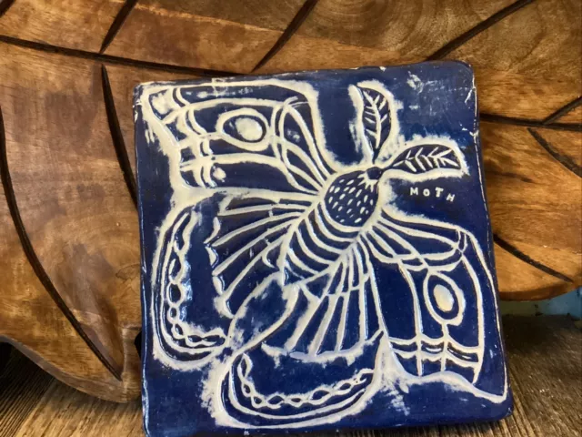 golden egg pottery hardwick Massachusetts moth pottery trivet blue and white