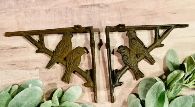 A pair of antique Victorian exotic bird brackets cast iron shelf bracket