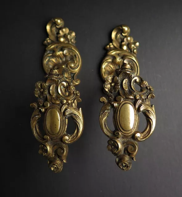 A PAIR OF ORNATE LATE 19th CENTURY FRENCH GILT BRASS TIEBACKS, BAROQUE REVIVAL
