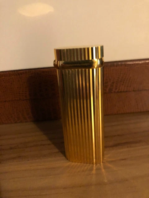 Accendino Cartier placcato oro con Rubino