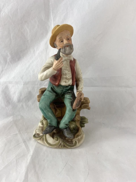 Vintage Bisque Porcelain Figurine Old Man Sitting Smoking His Pipe 6 Inches Tall