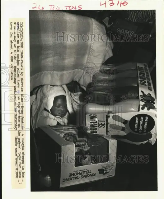 1988 Press Photo Ryan Jenkins with his toys at Toys for Tots Give-a-Way, Slidell