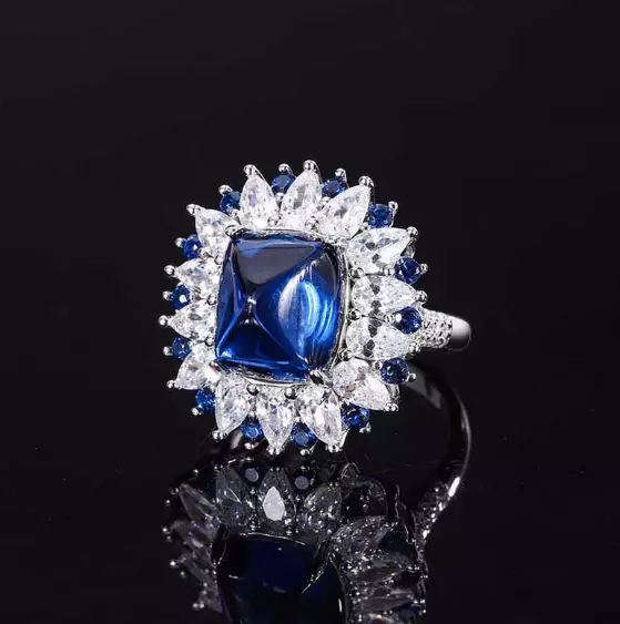 Features Sugarloaf Blue Sapphire & Lab-Created White Diamond Flower Cluster Ring