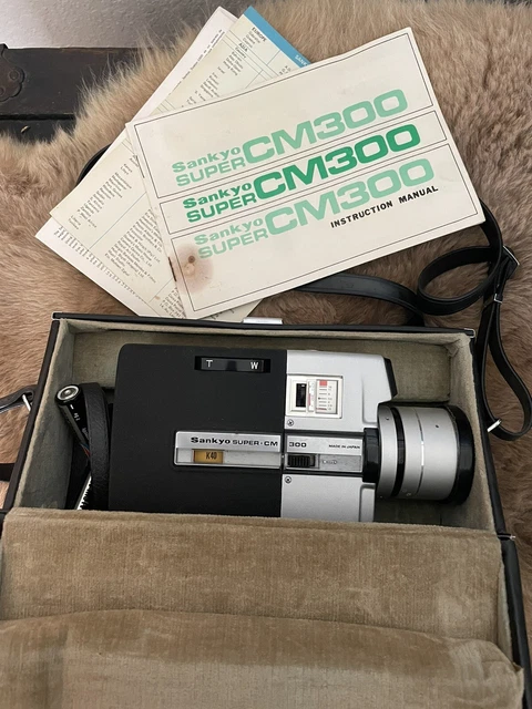 Cámara y estuche de película de cine Sankyo super cm300 super 8 - completamente funcionando. Probado.