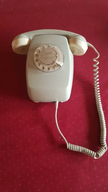 Altes Vintage Wandtelefon grau mit Wählscheibe