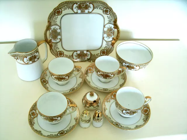 A Stunning Set of Gold Encrusted Noritake Basket of Flowers Tea Ware