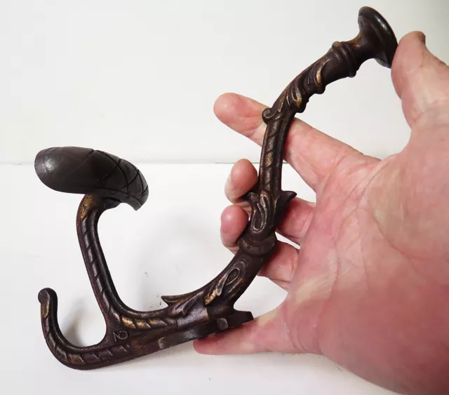 A 19th CENTURY PERIOD CAST IRON COAT HOOK