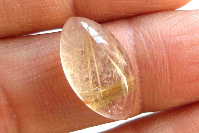 Pierre précieuse de rutile, forme de marquis de cabochon doré, fabrication...