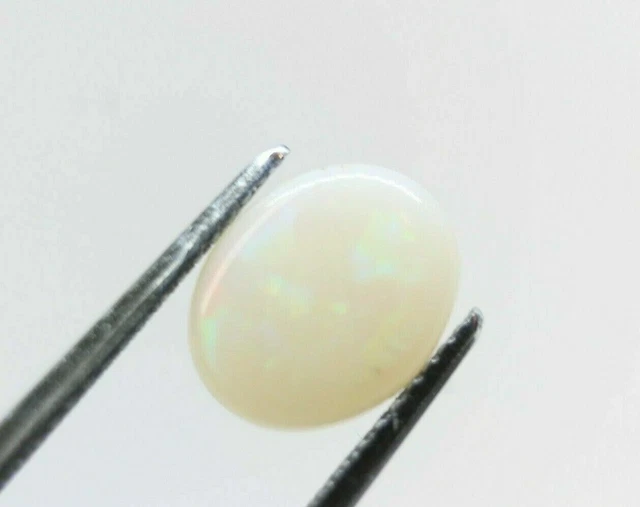 Opale blanche 1.37ct 9.9x8mm Cabochon ovale naturel éthiopien