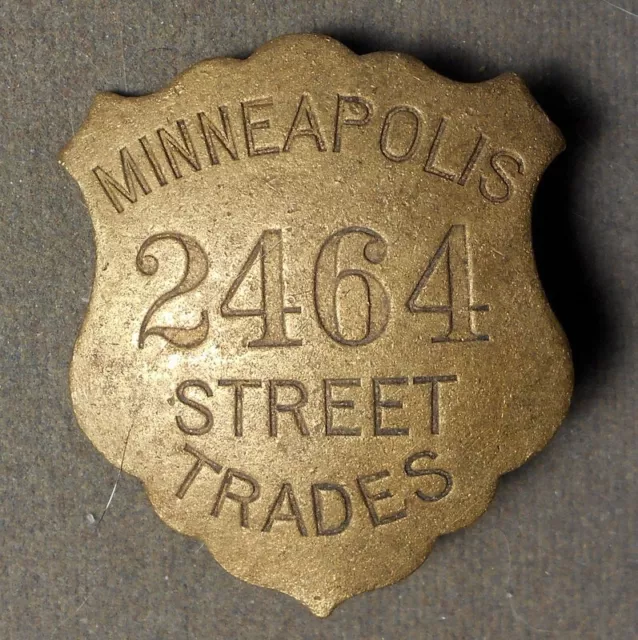 Badge: Minneapolis Street Trades, #2464. Brass, all incuse, pin intact, about 44
