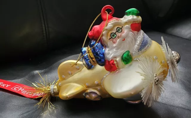 Kurt Adler Pollonaise Santa in a Gold and Silver Glittered Airplane