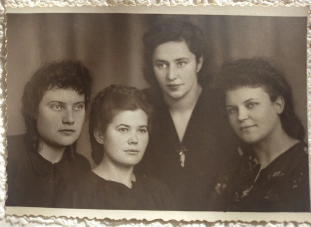 Vintage Photo. Portrait photo of four girls with hairstyles