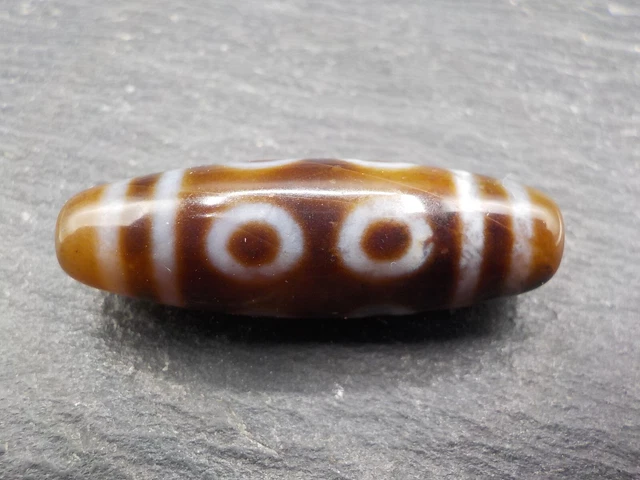 An Agate Dzi bead with an 8 Eye pattern from Tibet / Nepal.
