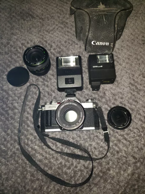 Canon AVI Camera, 50mm 28mm Lens, Canon & Sunpak Auto Flash,  Case, Strap Set