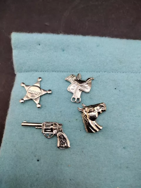 Lot of 4 WESTERN Themed PINS Horse head Saddle , Gun, Sheriff Star Badge