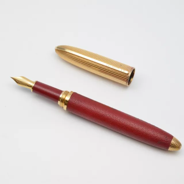 Louis Vuitton, a red leather and gold plated 'Doc Cuir' rollerball
