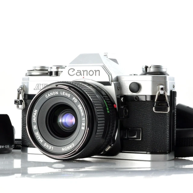 Appareil photo reflex argentique canon ae-1 obj canon 50 m/m à Benais