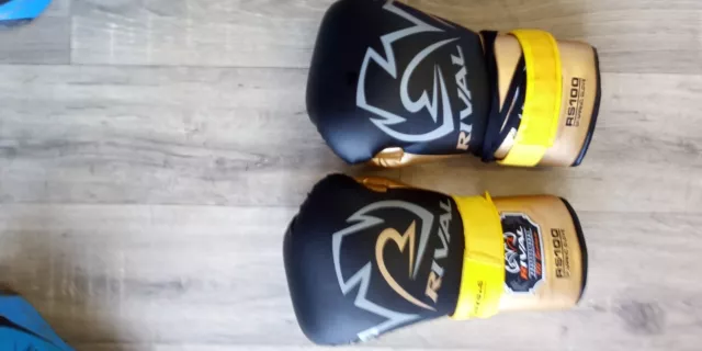 rival rs 100 boxing gloves black and gold with straps