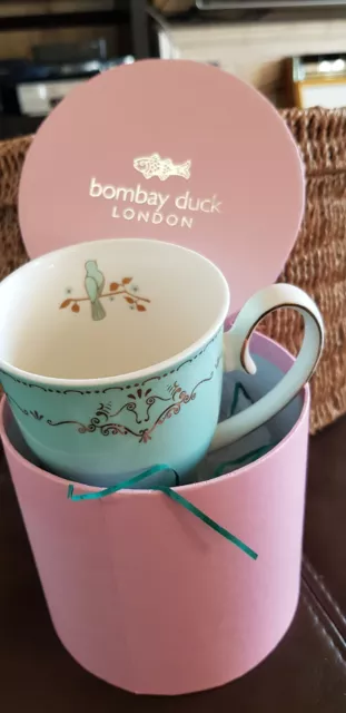 https://www.picclickimg.com/1vEAAOSwphFeyr7X/Bombay-Duck-London-Mug-Miss-Darcy-Bird-Mint.webp