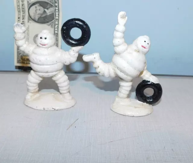 2 Michelin Men Man Figures Statues Lifting Rolling Rubber Tires
