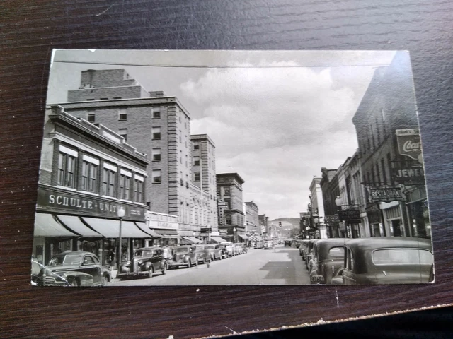1930s Street scene Coca-Cola sign Schulte United, RPPC Photo Postcard