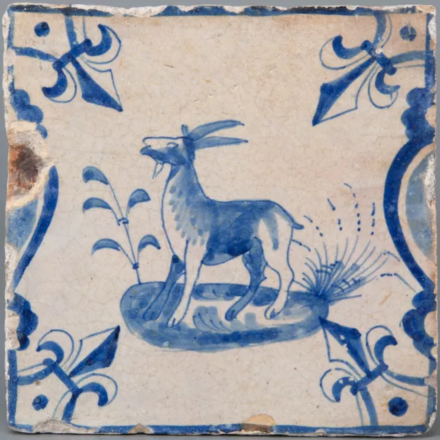 Nice Dutch Delft Blue candelabra tile, goat, first half 17th. century.