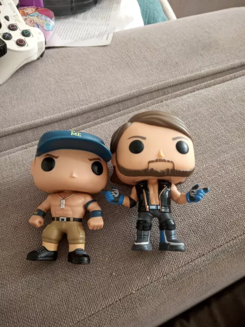 Funko WWE Figure Aj Styles e John Cena berretto blu