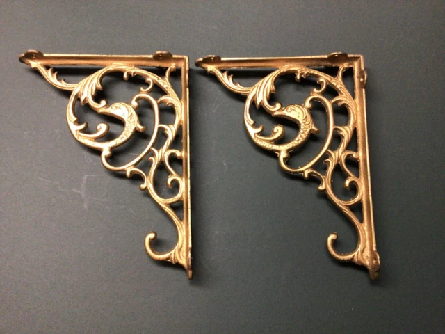 Pair of Vintage ornate shelf brackets cast iron with stylized dolphin 